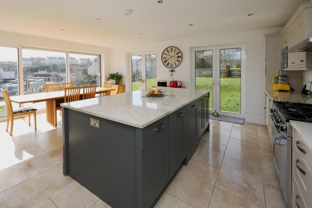 Kitchen/dining room 19 9 x 17 7 A fabulous extension to the original house fitted with a range of units with Quartzite work surfaces incorporating a Belfast sink.