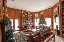 Beautiful wood beams stretch across the ceiling of the family room,