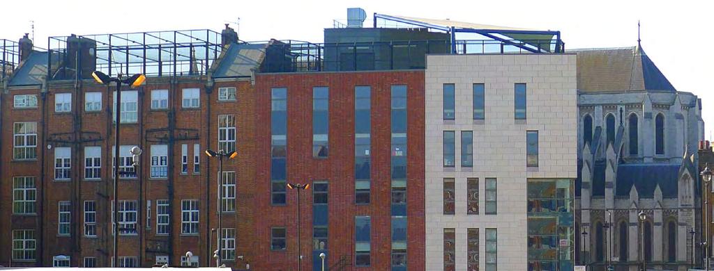 The site (seen on the left) presents a uniform facade and parapet Waitrose 1997 late C18th 2009 1980s