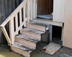 were damaged steps and damaged gutters found on the property.