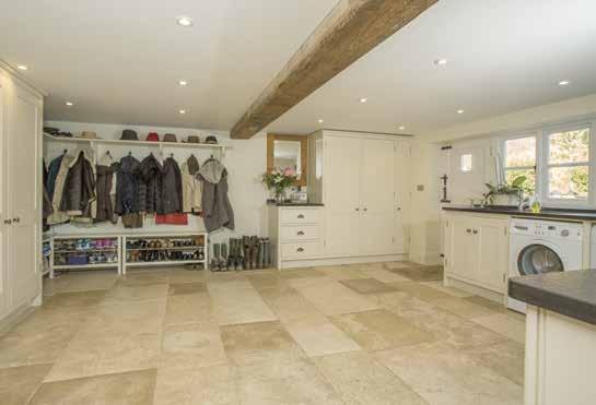 The family room leads to a stone floored corridor, off which is the sitting/cinema room and also provides access to a substantial cellar.