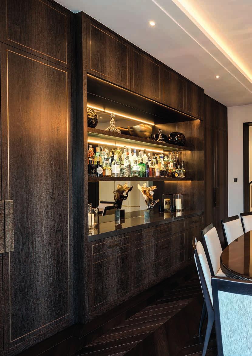 THE DINING ROOM FEATURES BESPOKE JOINERY, WITH