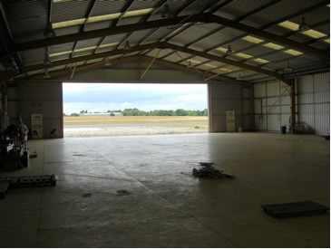 The hangar doors are manual sliding doors giving access to a large apron which has direct access to the Biggin Alpha taxiway.