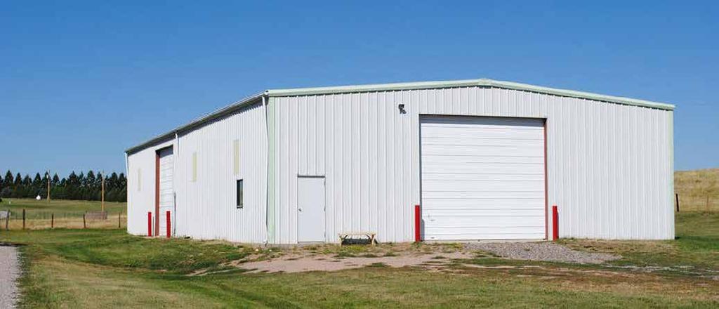 The 5,000 sq. ft. shop has metal siding and roof as well as a 6-inch concrete floor. A 5,000 sq. ft. metal frame construction shop.