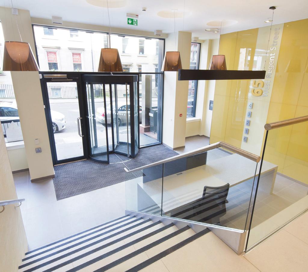 revolving + evolving Following comprehensive refurbishment the building is entered via a new revolving door, which in turn accesses a striking new reception area creating a welcoming and memorable