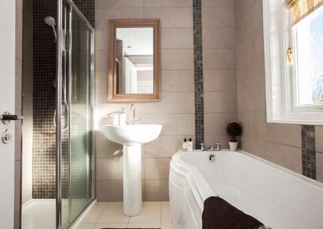 FIRST FLOOR RETURN BEDROOM (1): 6 9 x 9 2 (2.06m x 2.79m) BATHROOM: Panelled bath with mixer taps. Pedestal wash hand basin, with mixer taps.