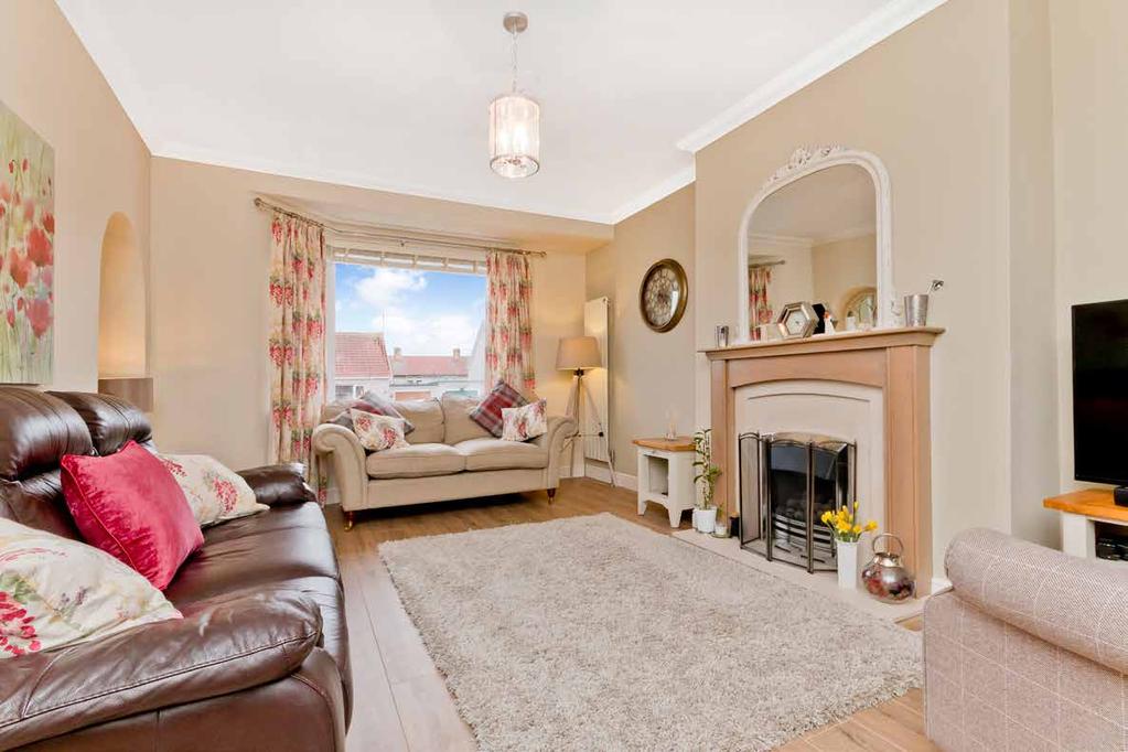 Leading off the hall and extending the full depth of the property is the very heart of the home; a generous living and dining area positioned beside a well-appointed kitchen.