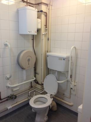 Emergency assistance can be provided by pulling the emergency cord on the right hand side of the toilet as you face it. This will create an audible alarm.