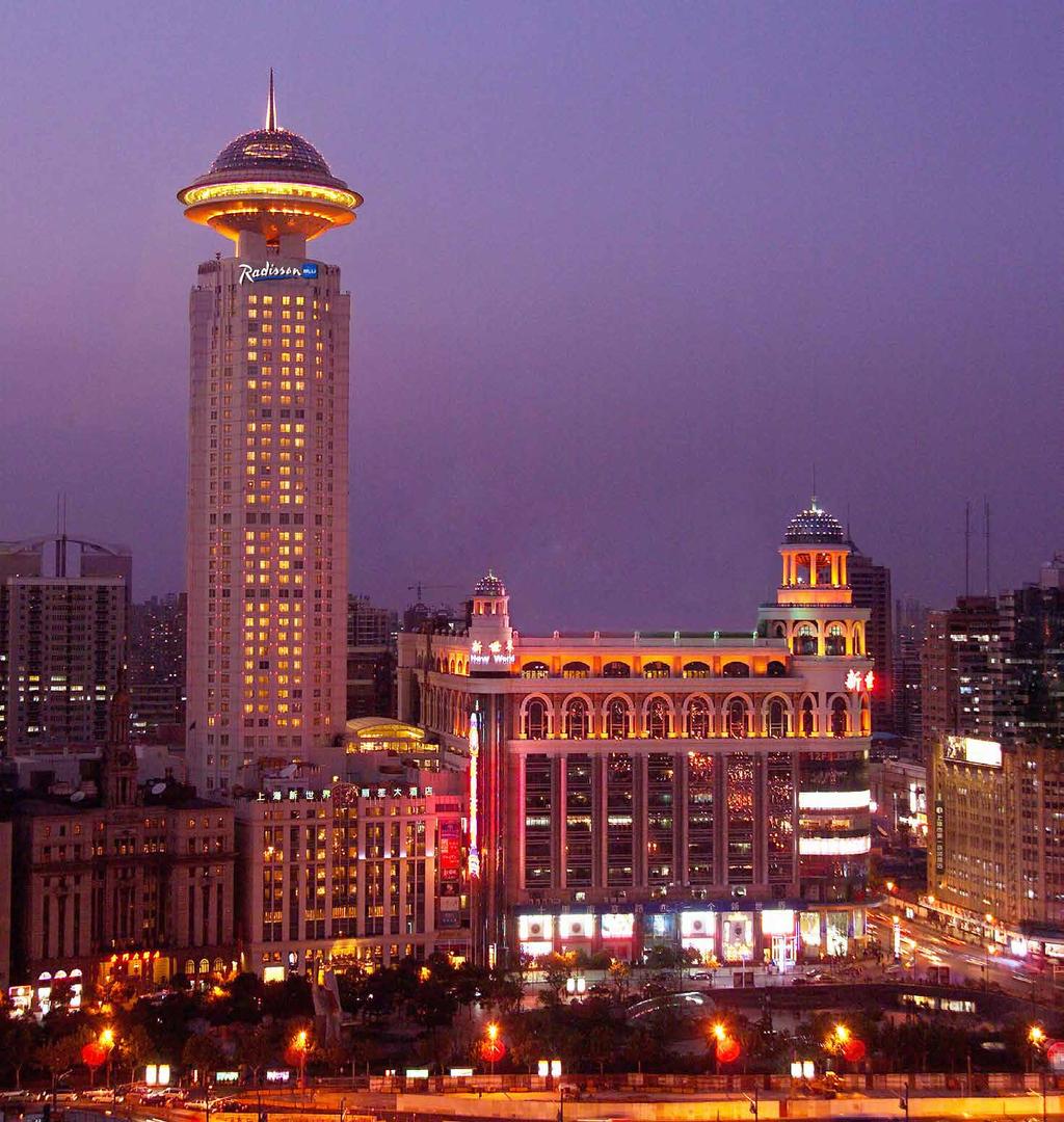 Radisson Blu Hotel Shanghai New World This 682 ft. (208 m) tall hotel stands in the city s Huangpu district. The original structure was completed in 2001, while the dome was added in 2005.
