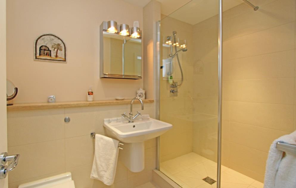 Door to: En suite shower room 8 x 5 Fitted with a modern Duravit 3 piece suite comprising large walk-in shower cubicle with