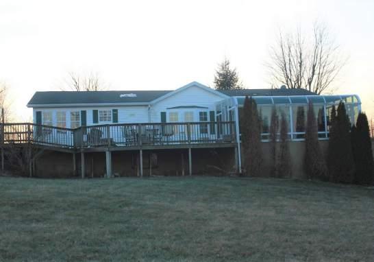 ELECTRIC 55' FENCED ROUND PEN WASH BAY, TACK & FEED ROOMS 1700 ± MODULAR HOME W/BSMT BiedermanRealEstate.