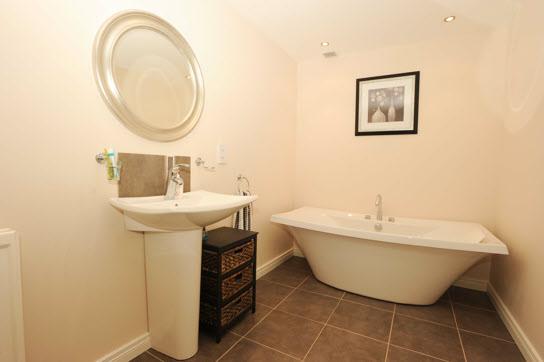 BATHROOM: Luxury white bathroom suite