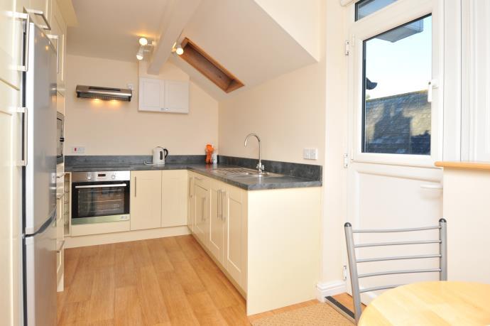 Built in stainless steel cooker and cooker extractor hood. Ceramic electric hob. Built in stainless steel microwave. Hall access to roof void.
