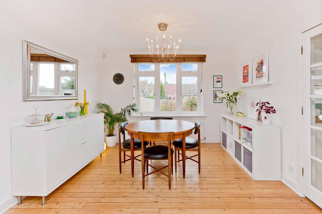 Conveniently accessed from the dining room as well as the hall is a dual-aspect fitted kitchen leading into a conservatory and the garden beyond.