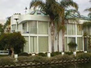 Art moderne with streamlined, horizontal lines and curved ribbon windows. Venice Beach, CA.