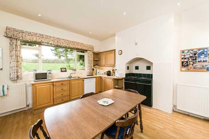 The kitchen/breakfast room is located to the rear of the house and is fitted with a range of units, sink and drainer, has space for a rangestyle cooker, is plumbed for a dishwasher and offers ample