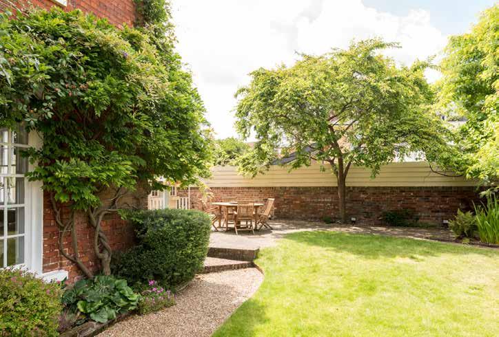 Step Outside Stylish Elegance Aspirational Location The brick wall along Fen Street conceals the beautiful garden that fronts the property and from where there are glorious views of the church tower.
