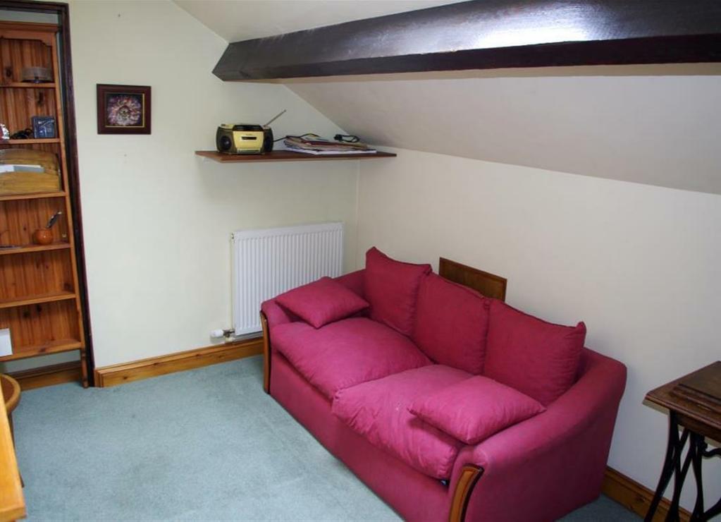 The ground floor accommodation comprises side and main front reception halls, inner