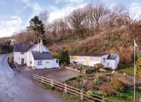 00m (15 1 x 13 1 ) Extending to approximately 185sqm (2,000sqft) with single glazed timber windows, The Mill House, dating from the 17th Century, is constructed of axe-dressed painted stone with a