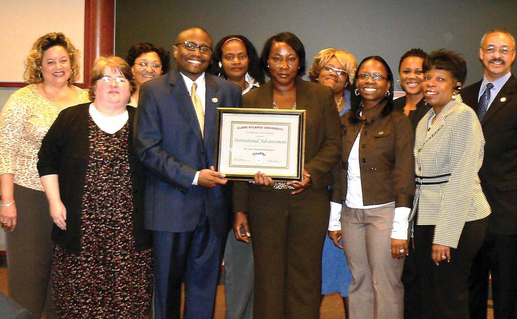 Members of CAU s Division of Institutional Advancement and University Relations accept a Certificate of Excellence Award for CAuPRI accomplishments from President Carlton E.