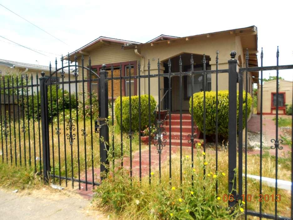 This poorly maintained Fannie Mae REO in Oakland depresses the whole block.