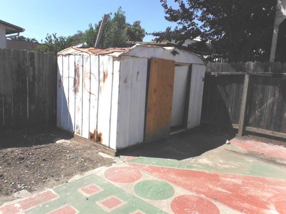 This battered and unsecured shed should be removed by Fannie Mae to stop animals from nesting