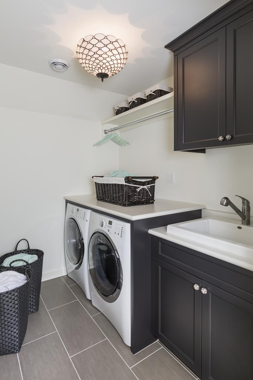 Side-byside front loading washer and dryers allow for a large countertop space for folding and a wide space for
