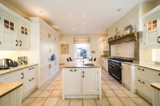 There are two further double bedrooms on the first floor, one with original fitted wardrobes, and a family bathroom with a white suite comprising freestanding ball and claw foot bath,