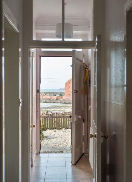 The conservatory is a main feature of the property, providing breath-taking coastal vistas. A double bedroom benefits from similar privileged sea views.