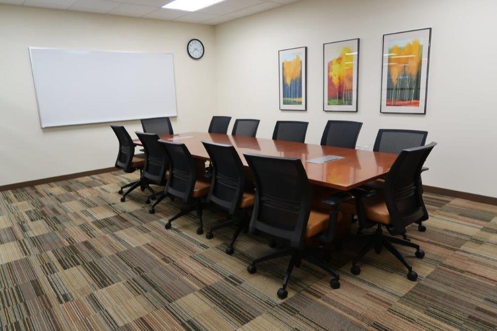 conference room Shared training/meeting room with audio/video equipment Outdoor rooftop deck/garden with mountain and Old Mill views Men's and women's locker room