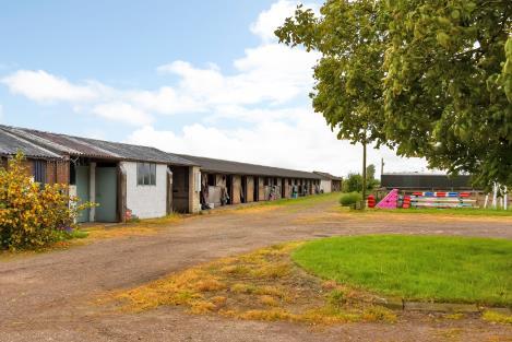 Plus an additional brick stable block which comprises 4 stables, 2 pony boxes all with plumbing for