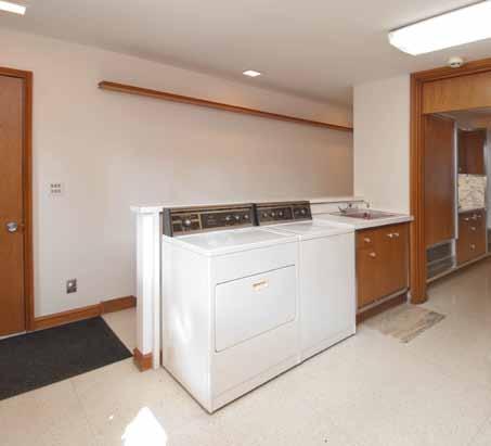 Laundry/Mud Room The attached laundry room offers additional storage in the wall of closets (pull-out drawers are
