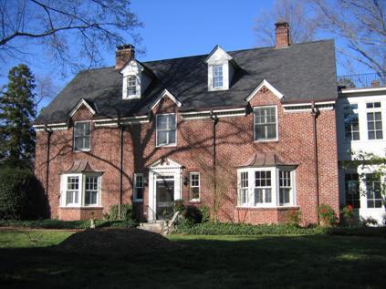 Restormel is a solid brick two-story, side-gabled house.