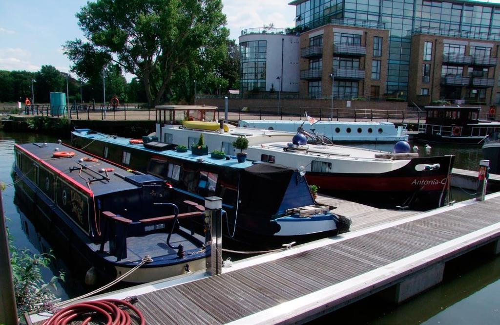 Description The moorings are approached by pedestrian public walkways which lead from Brentford High Street via the Ferry Quays development under which the car parking spaces are located.