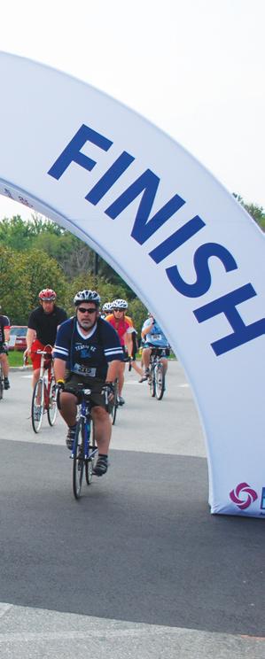 Cyclists begin their trek of 25, 50, or 100 miles at the second annual Champion the Cure Challenge to benefit local cancer research at EMMC. director of advancement for Blue Hill.
