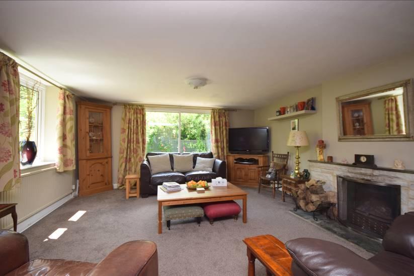 The property provides comfortable accommodation which includes 2 and well proportioned receptions room, stunning west facing garden room, kitchen, utility room and bathroom.