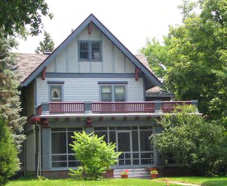 On the south side is a large two-story bay window with very narrow diagonal wood siding. The metal porch supports are an alteration and not a part of the Italianate style. Built in 1885 for F. T. McLain, it was on the edge of Ames at the time.