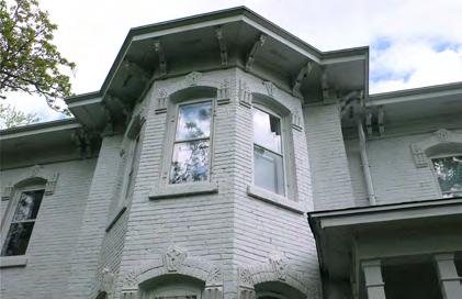 Some common details are a low-pitched hipped roof; deep cornice; eave brackets and tall narrow windows.