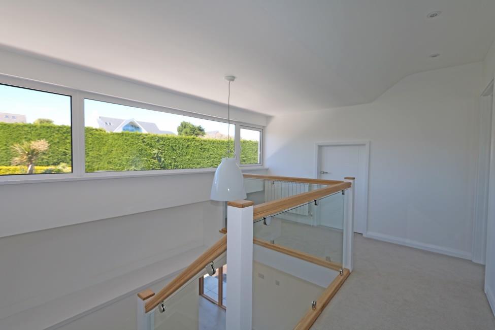 Double sliding doors to balcony excellent sea and offshore island views.