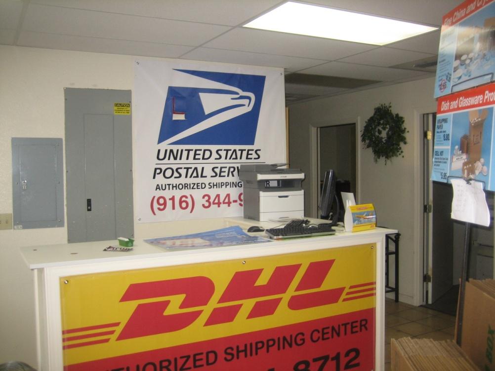 Photo of a postal service and shipping business in conjunction with the U-Haul business inside the existing