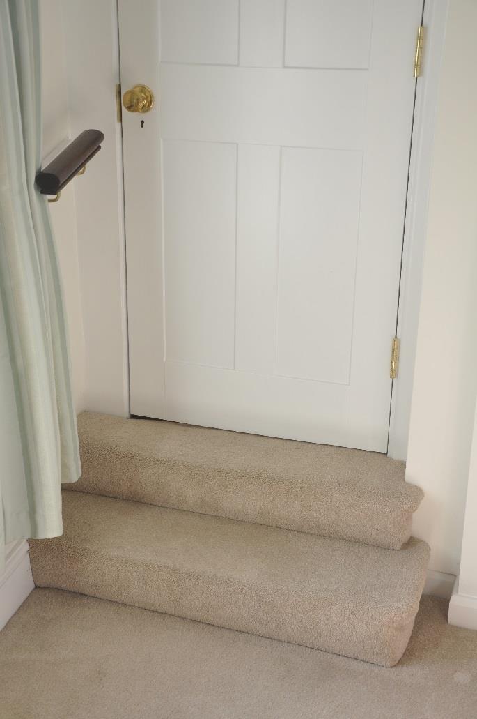 There are two steps from the bedroom to the main landing (see Photo 7) each of 16 cm (6.5 inches) height.
