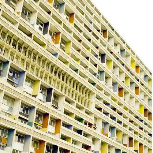 The Marseille building, developed with Corbusier's designers Shadrach Woods and George Candilis, comprises 337 apartments arranged over twelve stories, all suspended on large pilotis.
