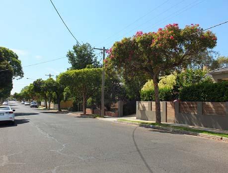 Street Infrastructure is defined by concrete kerbs and channels, narrow grassed nature strips and concrete footpaths.