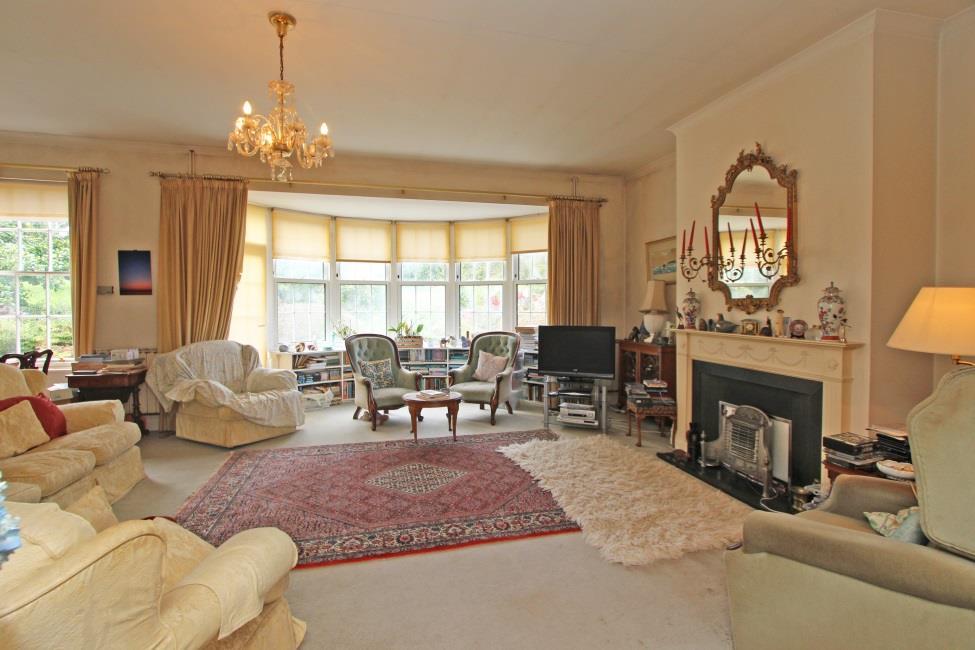 Lounge 23 7 x 18 3 Wonderfully spacious room with 9 10 high ceilings, which feature throughout the ground floor. Working fire place with slate cheeks and hearth with ornate wooden surround and mantle.