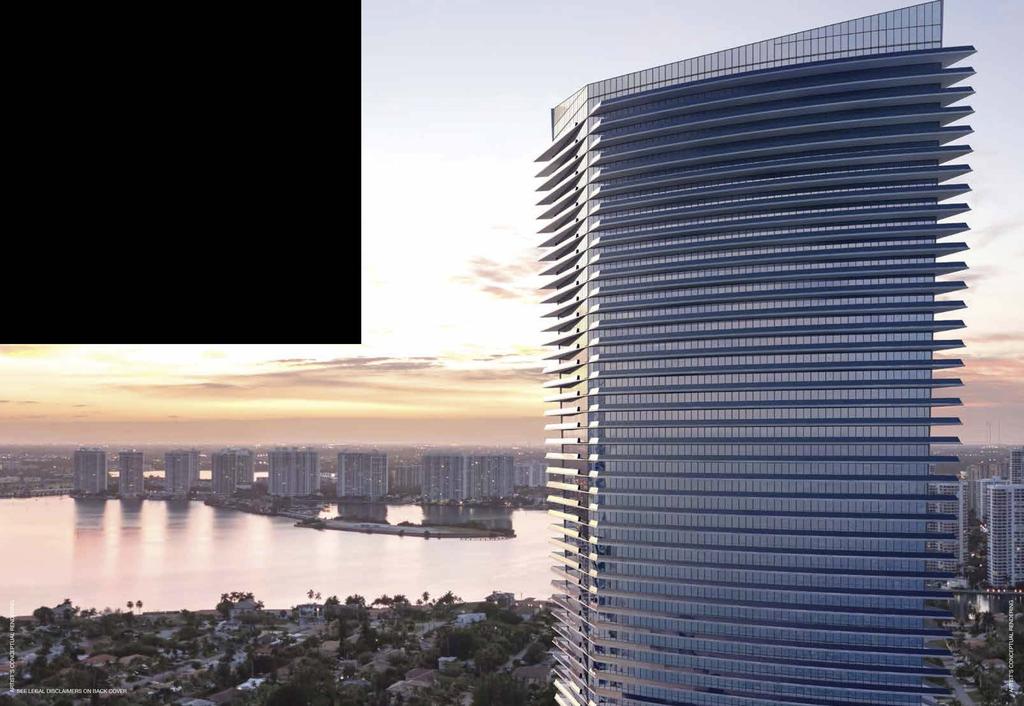 Pelli Clarke Pelli's contemporary glass tower appears at one with the crystal clear water of the Atlantic Ocean.