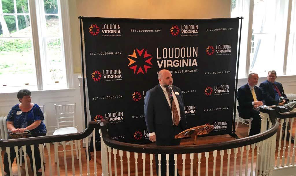 In The News Department of Economic Development Announces Record-Breaking Year Loudoun Economic Development Executive Director Buddy Rizer (center) speaks before the county business community at the