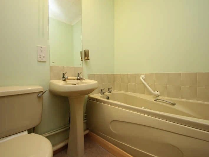 BATHROOM 7' 3 x 5' 7 (2.21m x 1.70m) approx: Bamboo-coloured bathroom suite comprising w.c., pedestal wash basin and panelled bath, with tiled splashbacks; mirrored wall cabinet; extractor fan; mirror; Creda fan heater; shaver pt.