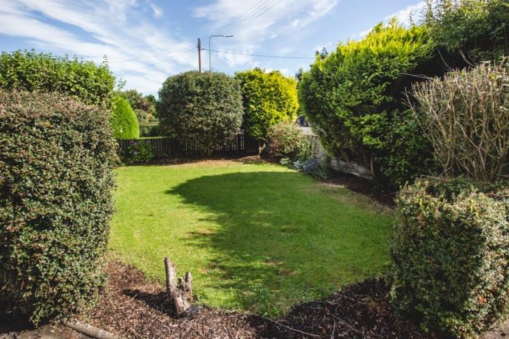 Gardens: Neat, enclosed and well stocked landscaped gardens front and rear with lawns and shrub borders displaying an array of mature plants, the front garden and driveway are externally