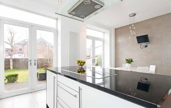 cornice; impressive dining kitchen with central island, base and wall units, integrated appliances including fridge, freezer, dishwasher, oven, induction hob, extractor and microwave and two double