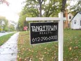 This home has a professional for sale sign in the
